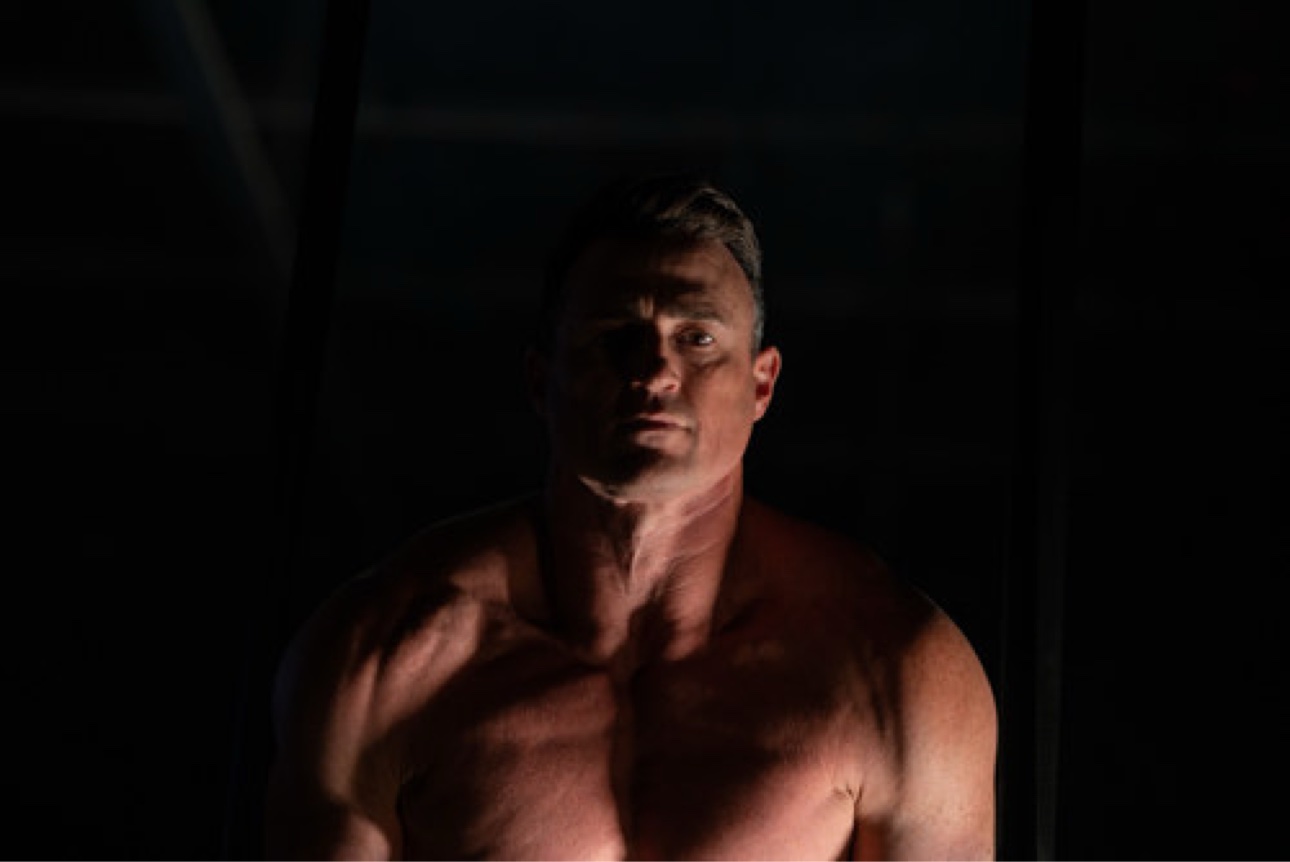 CrossFit CrownTown coach in a dramatic gym portrait