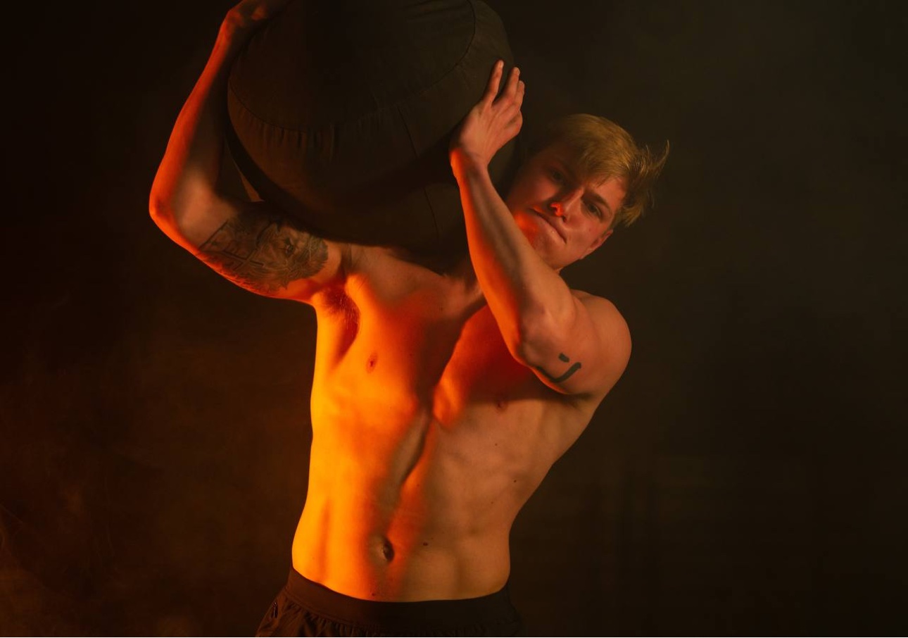 Athlete carrying a medicine ball at CrossFit CrownTown